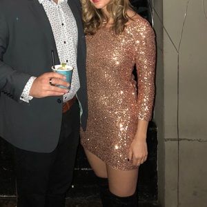 Short glittery gold mini dress with low back